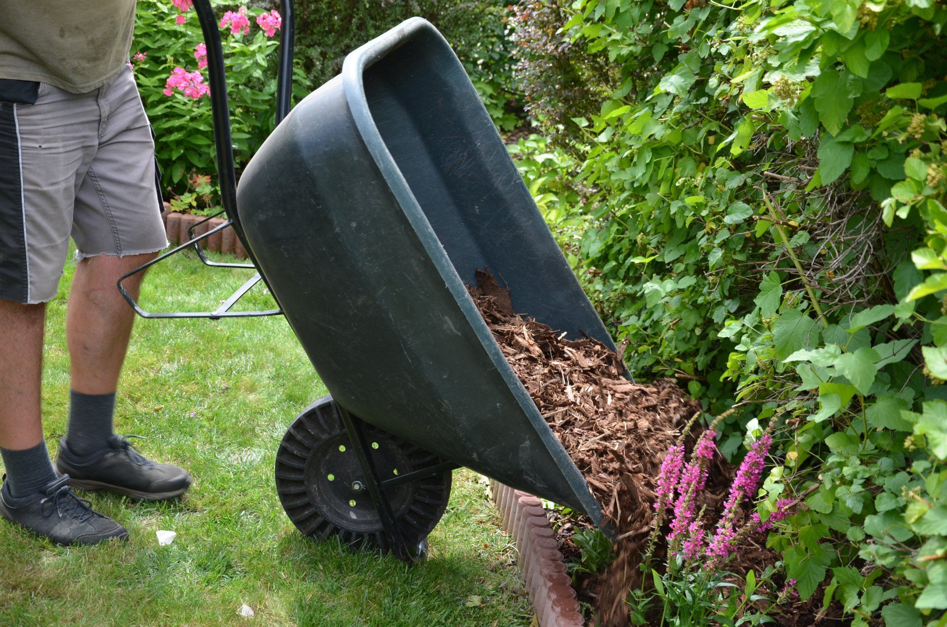 Putting mulch in flower beds