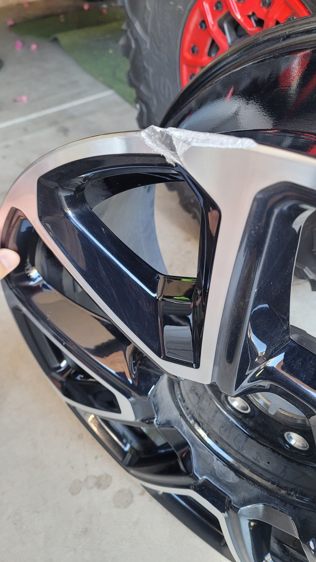 A close up of a car wheel with a hole in it.