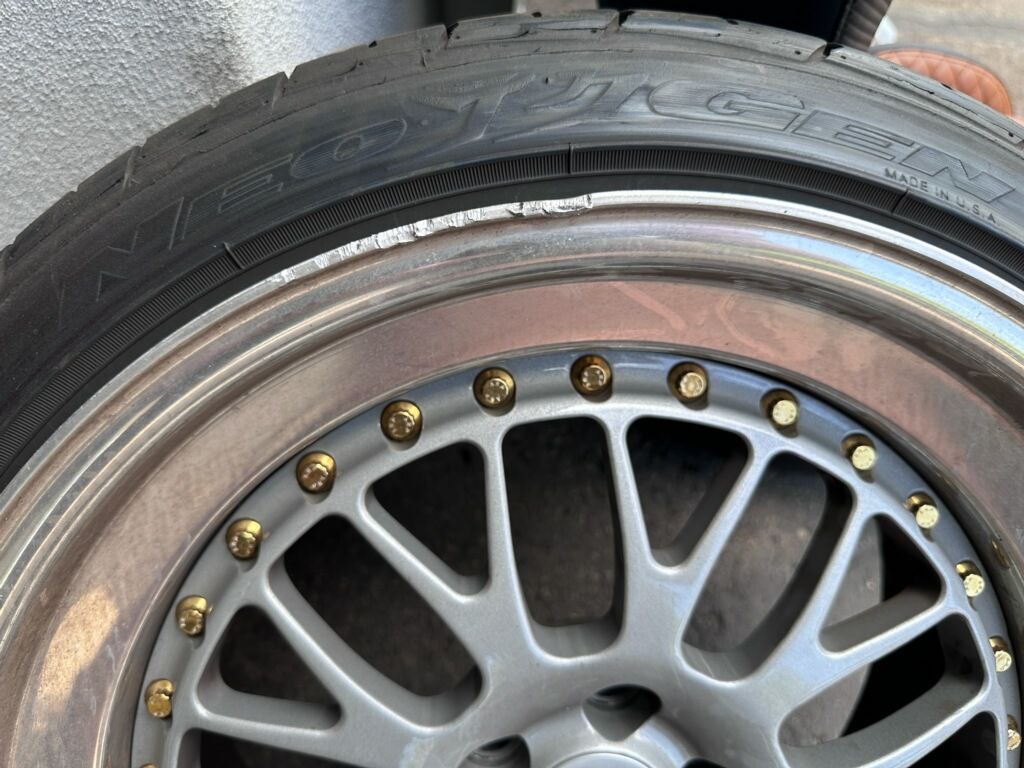 A close up of a tire on a car wheel.