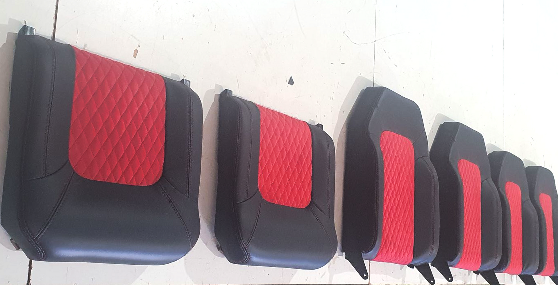 A row of six black and red diamond-stitched car seat covers — Tidy Trim Newcastle in Carrington, NSW