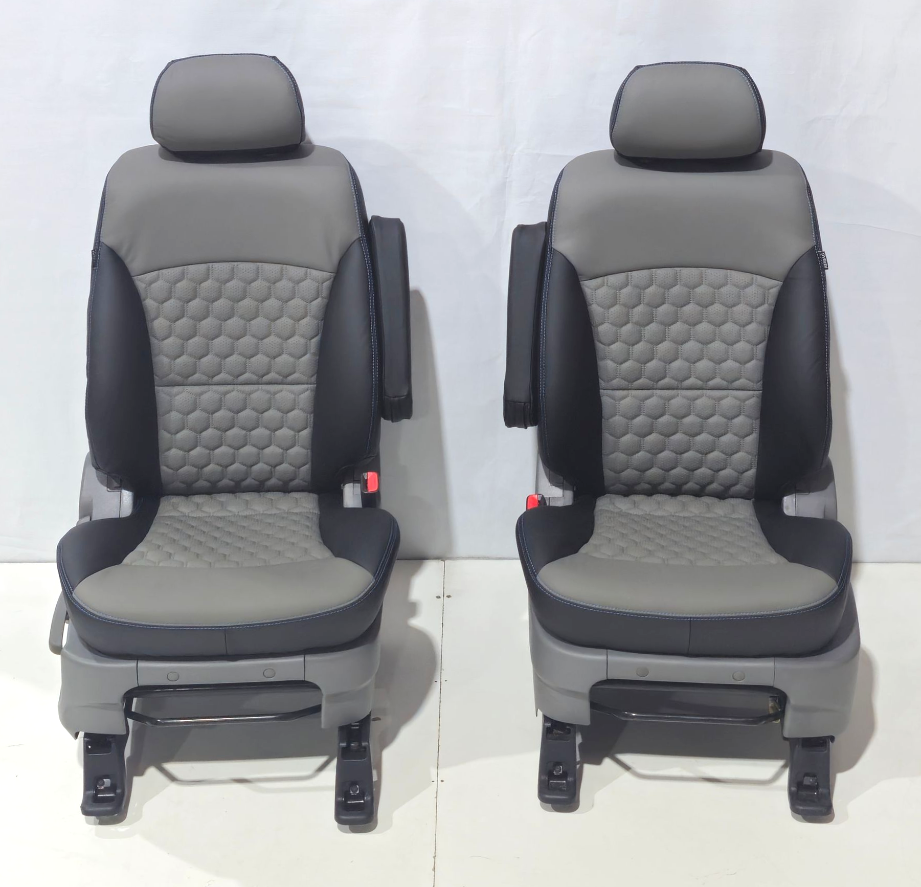 Two gray and black bucket seats with quilted honeycomb-patterned centers and armrests — Tidy Trim Newcastle in Carrington, NSW
