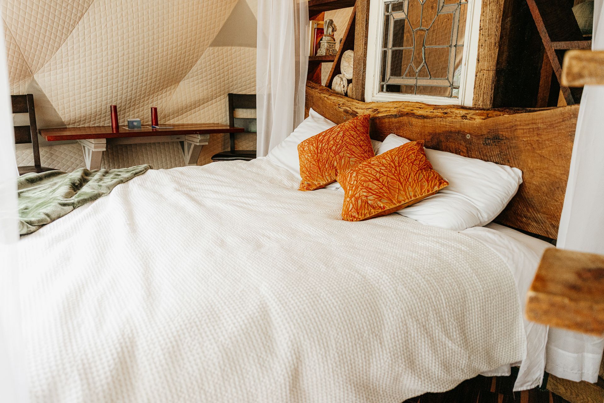 A bed in a camping dome