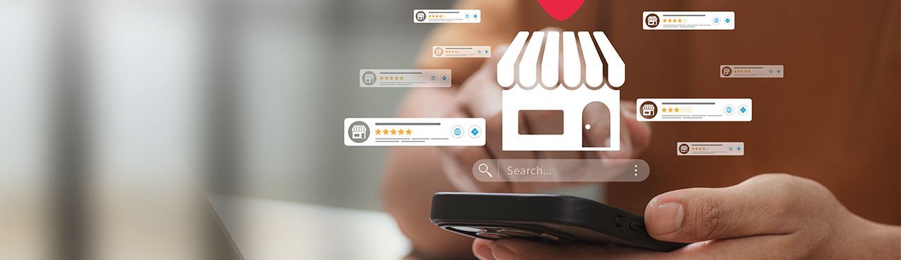 Hand holding a smartphone with a glowing online shopping interface and delivery icons on a blurred background