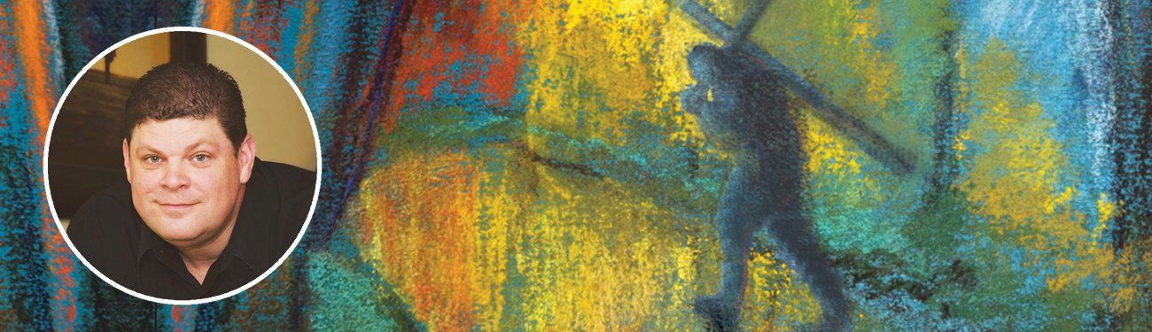 A man is standing in front of a colorful painting.
