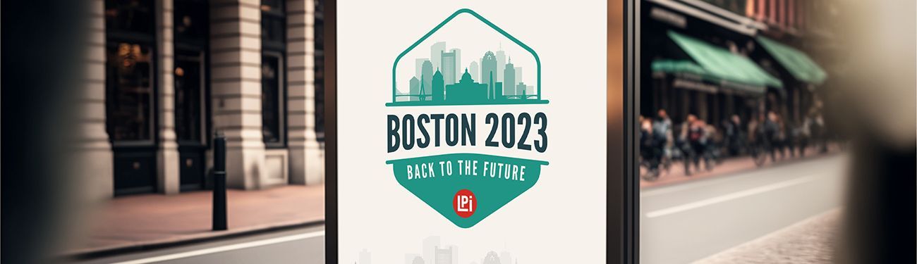 A billboard with a Boston 2023 logo is sitting on the side of a street in front of a building.