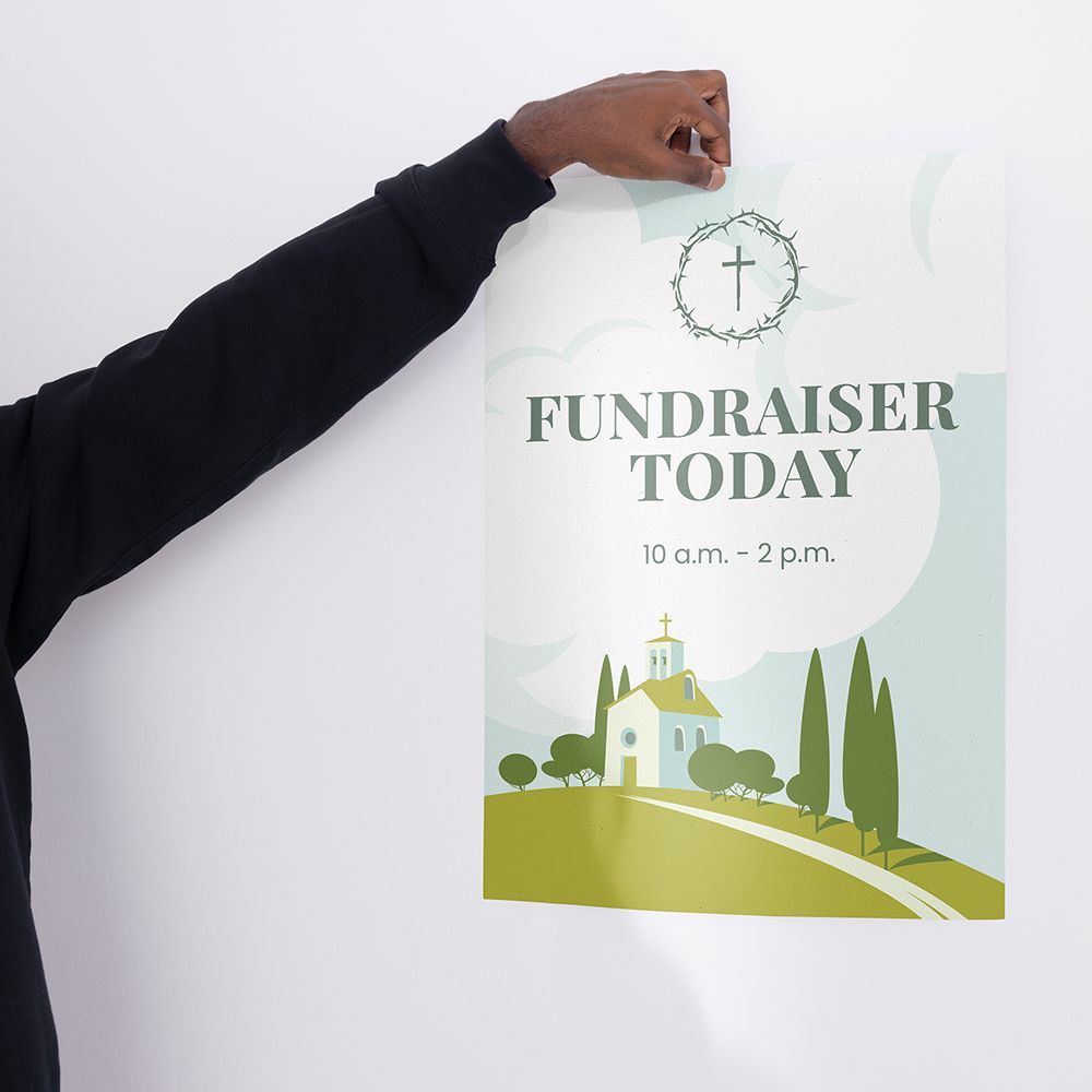 Hand holding a white sign with “FUNDRAISER TODAY” and a cross on it. 