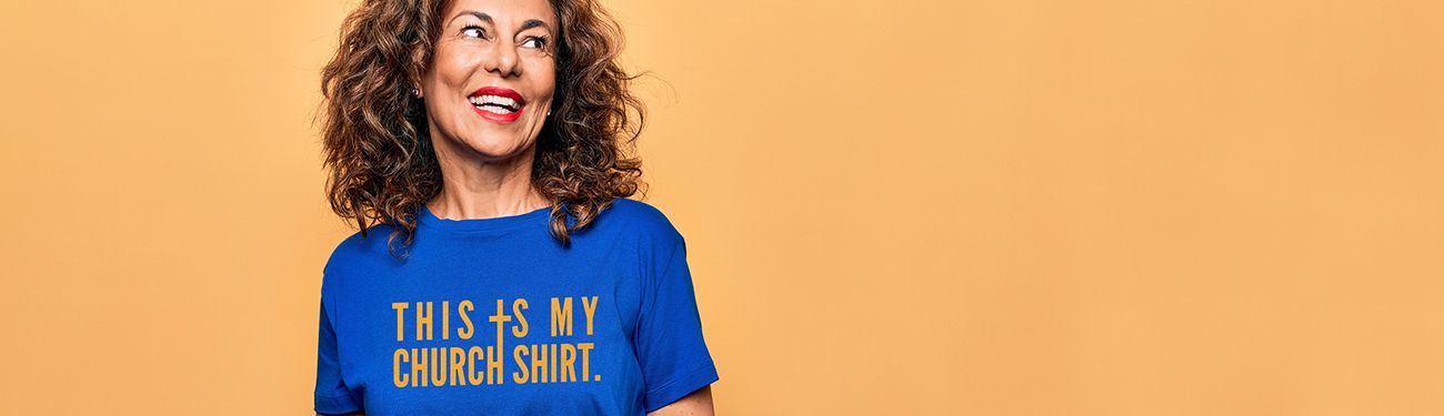 A woman is wearing a blue t-shirt that says 