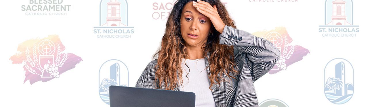 A woman is sitting in front of a laptop computer with her hand on her forehead.