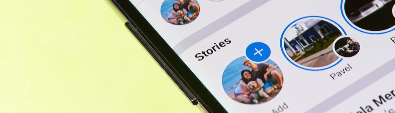 A close up of a cell phone screen showing stories.