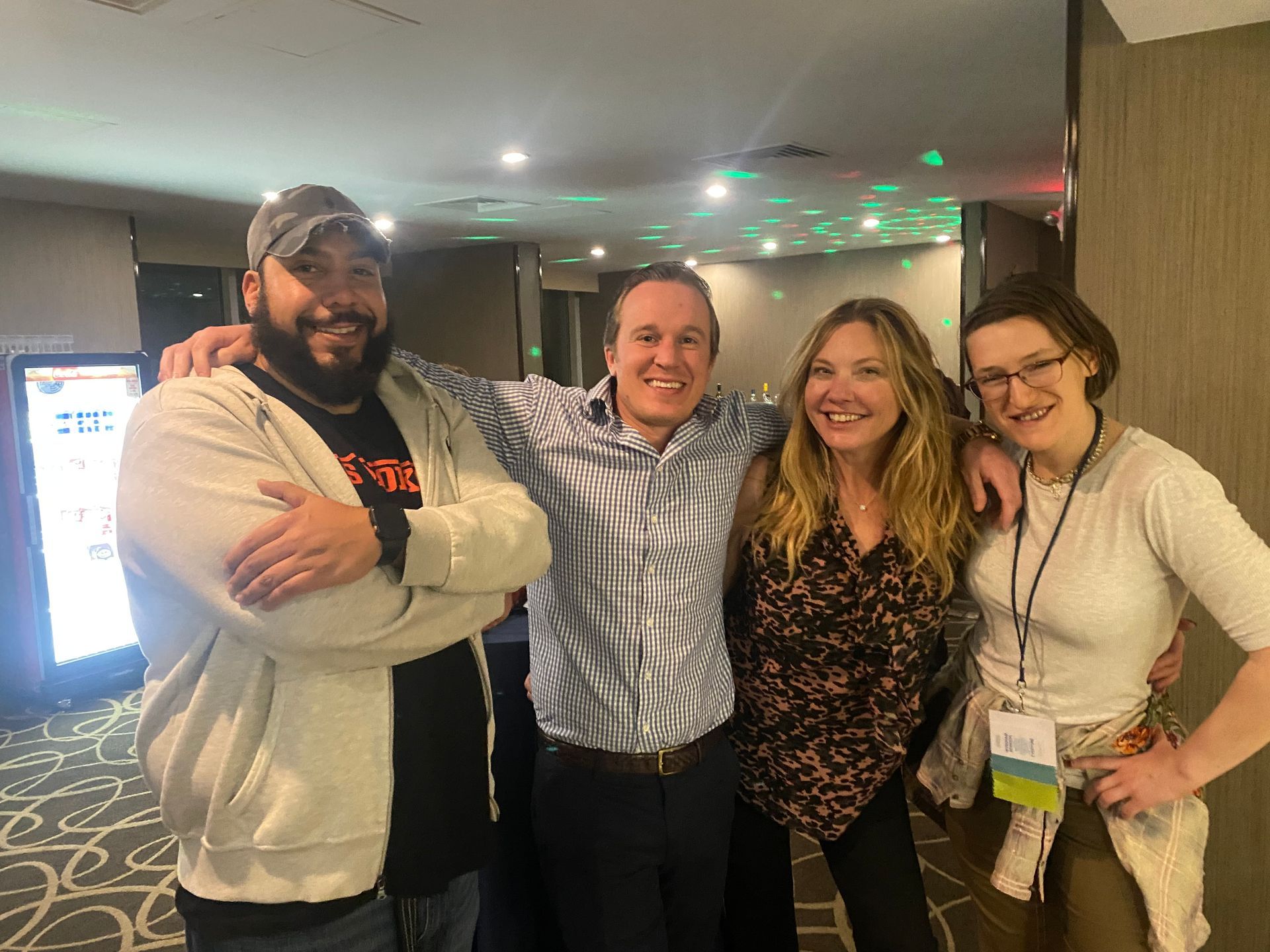 two men and two women smiling for the camera