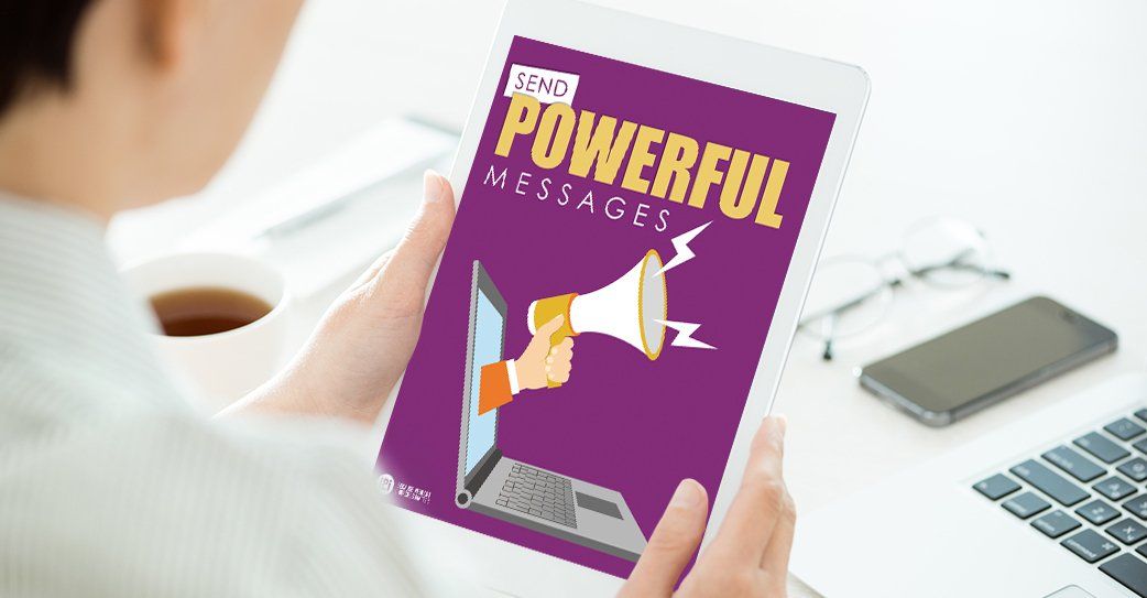 A person is holding a tablet with a powerful message on it.
