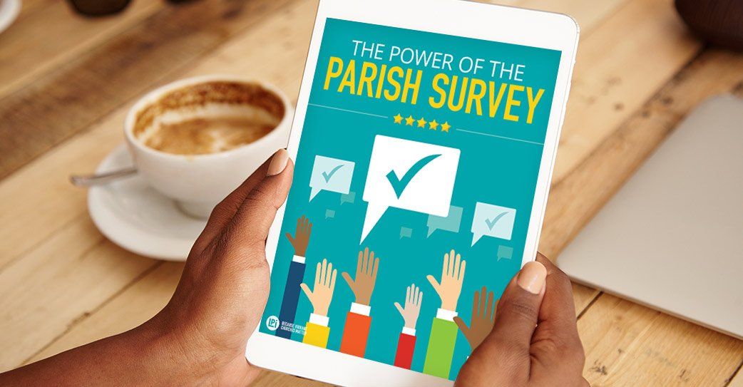 A person is holding a tablet with a parish survey on it.