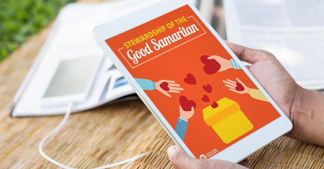 A person is holding a tablet with a book on it.