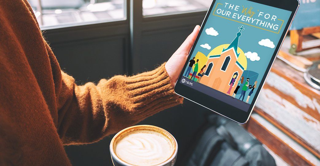 A person is holding a tablet and a cup of coffee.