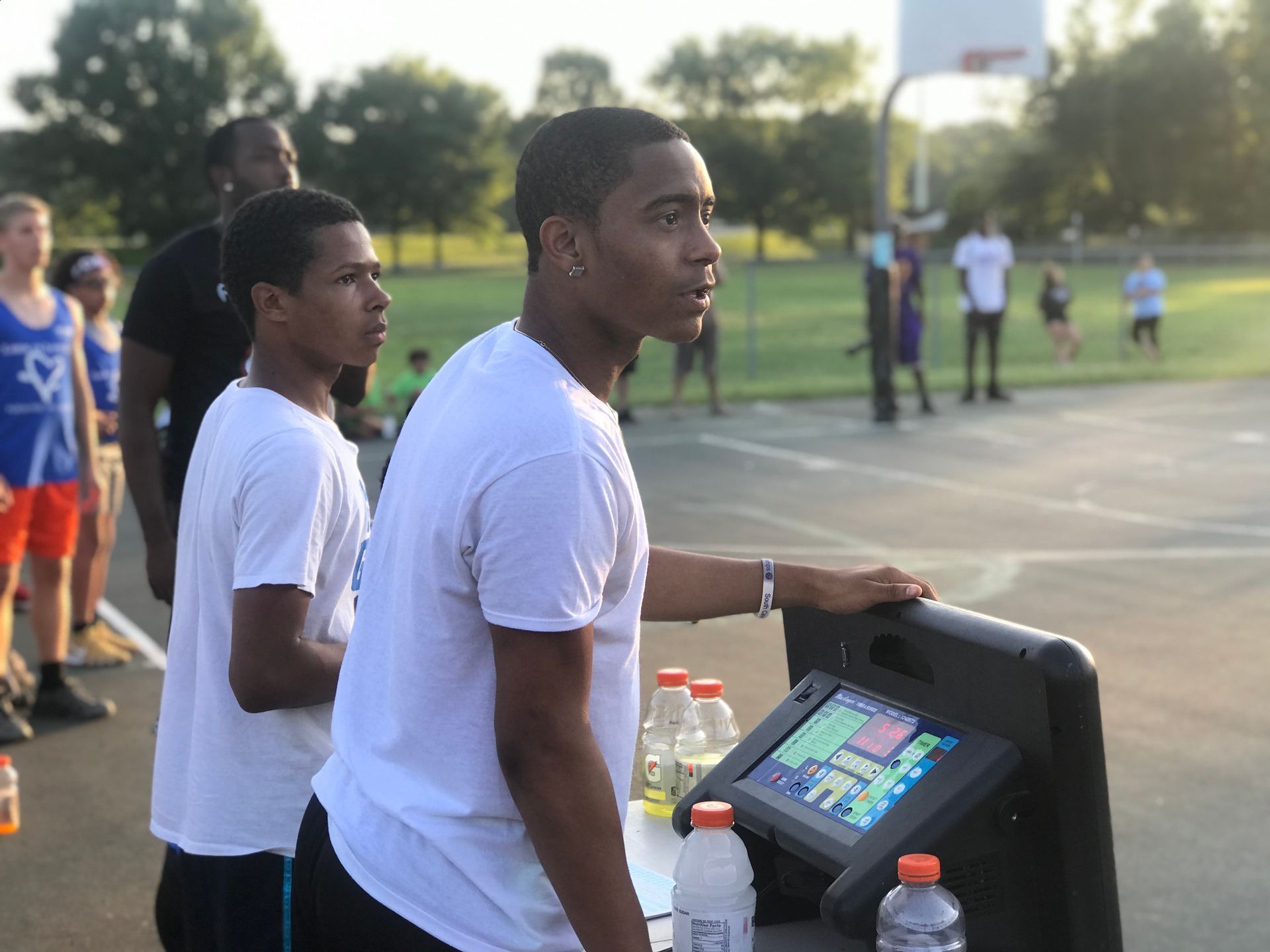 A group of young men are playing a game on a basketball court.