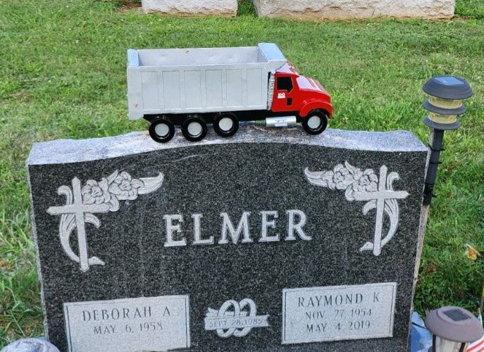dump truck on a gravestone