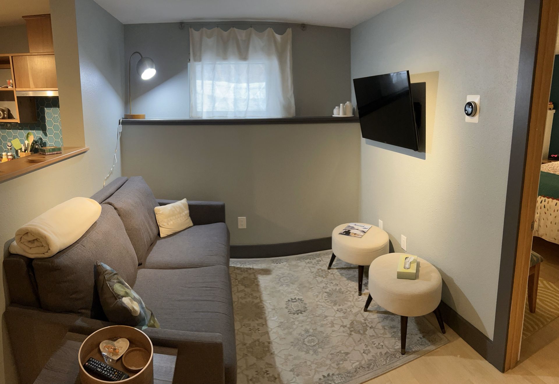 A living room with a couch and a flat screen tv