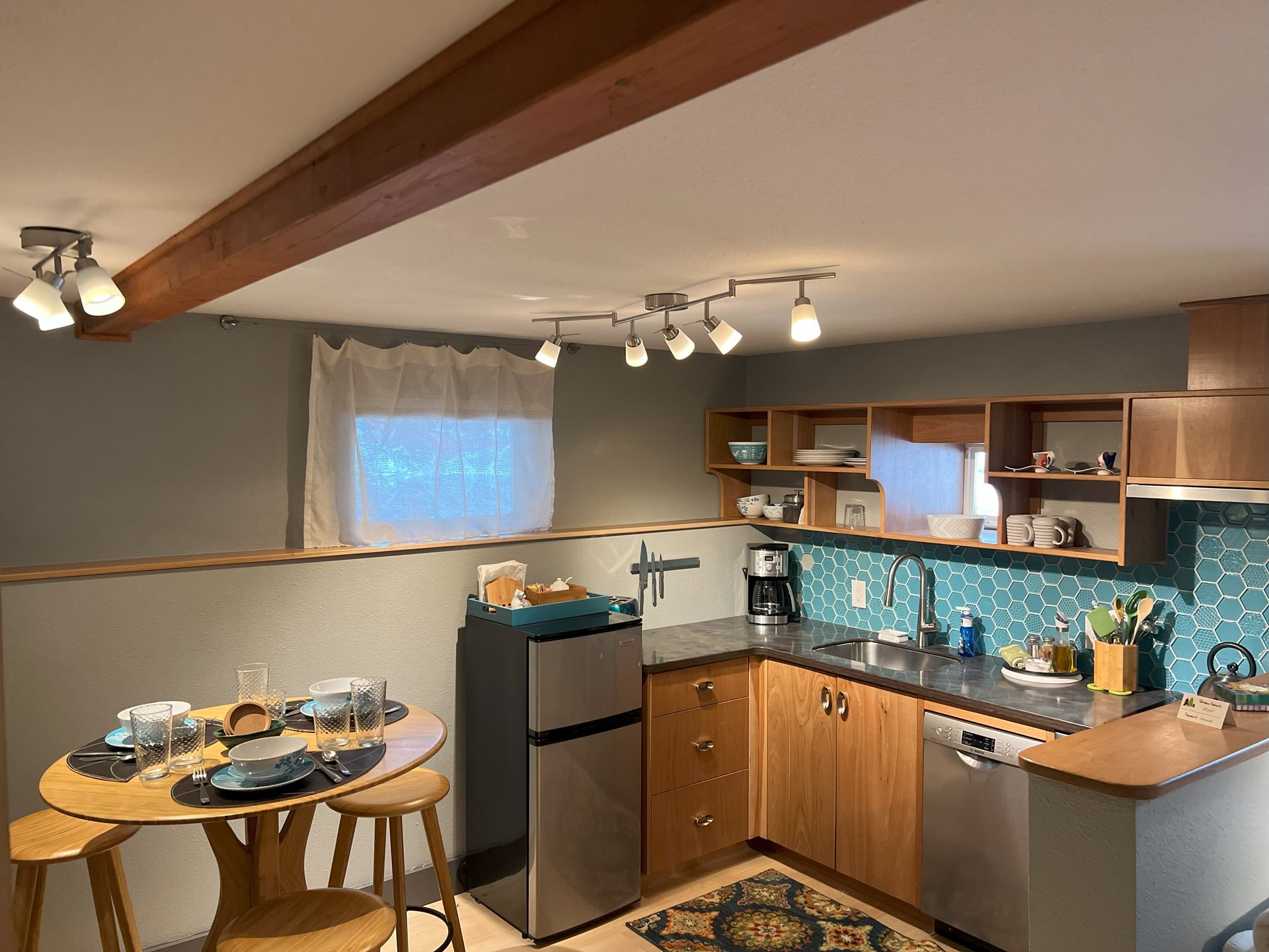 A kitchen with stainless steel appliances and wooden cabinets