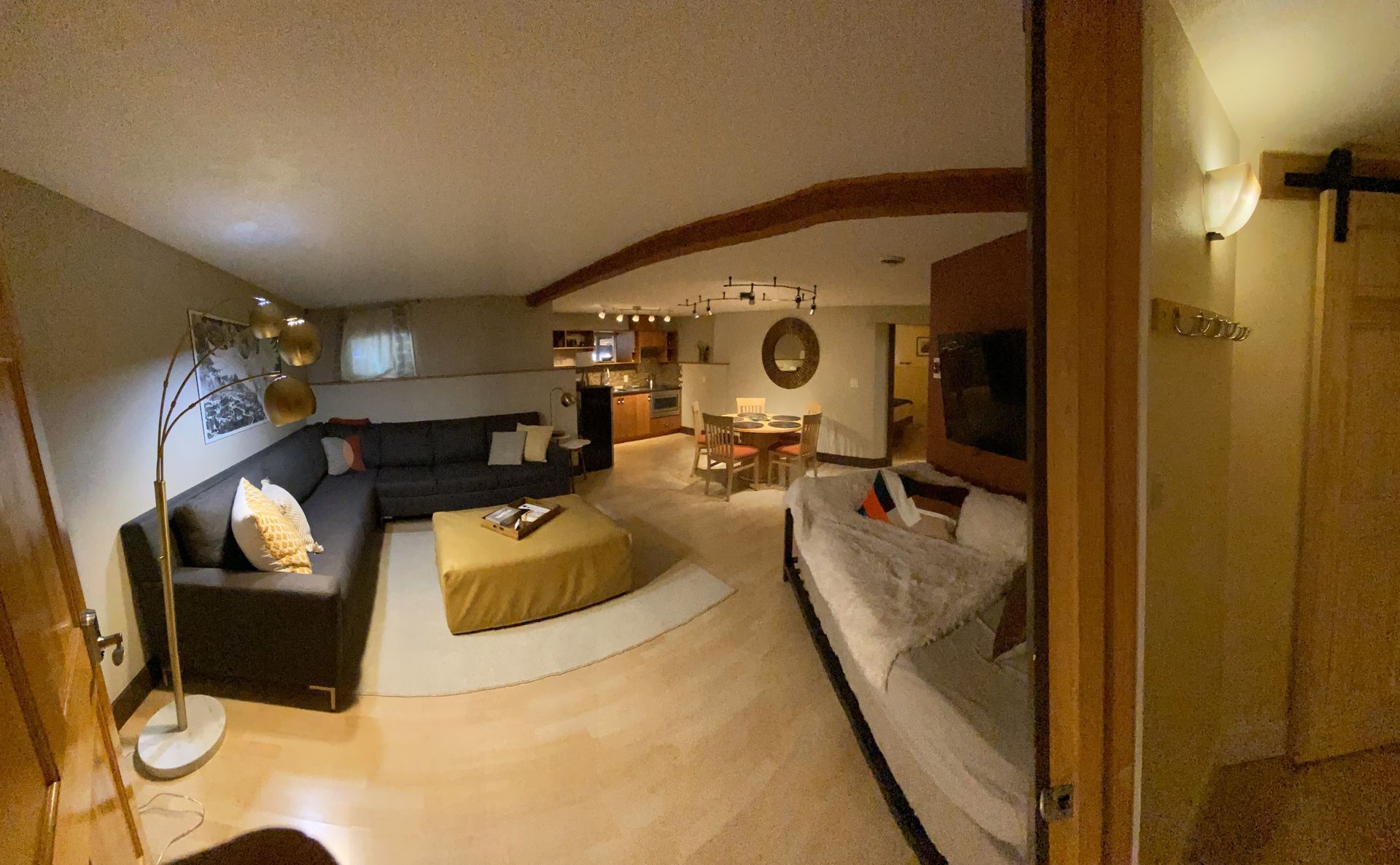 A living room with a couch and a table in it