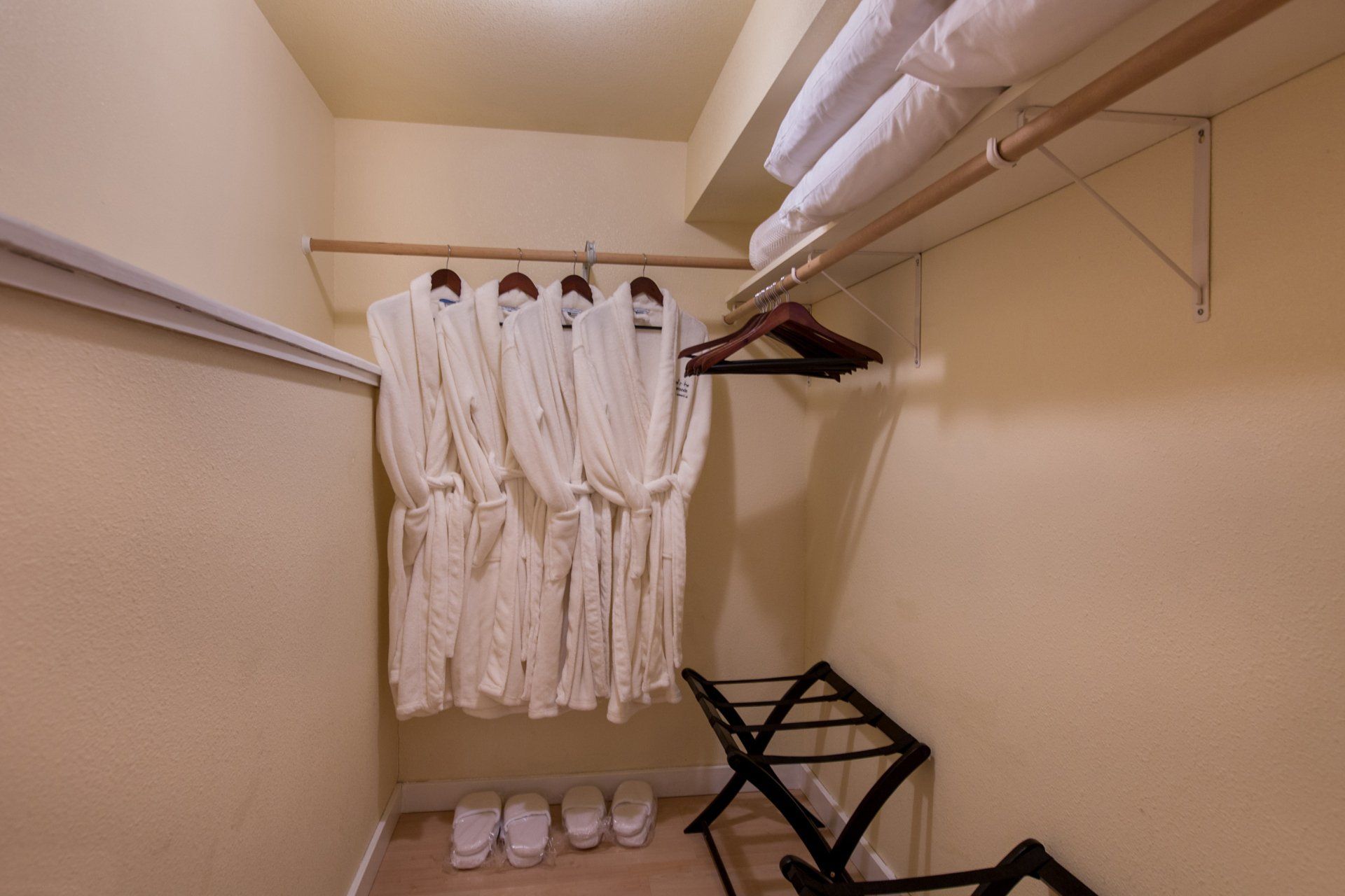 Mt. Benson Suite 1 bedroom suite in Bell In The Woods B&B in Alaska. Wardrobe with robes, extra pillows and slippers.