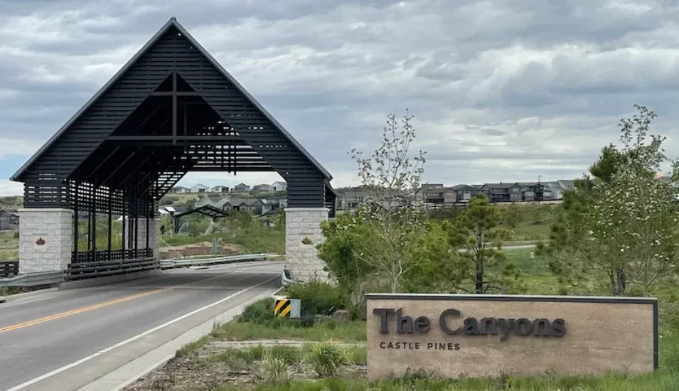 Bridge and sign entering The Canyons by Terracina Design.