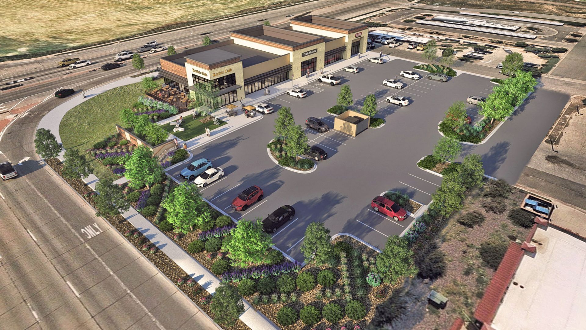 Aerial view of a modern shopping center with two main beige buildings and multiple cars parked. 