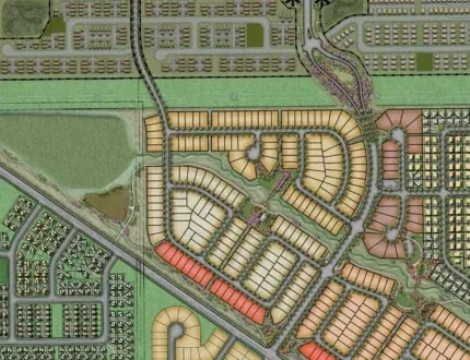 Aerial view of a detailed residential development plan featuring streets, houses, and green spaces.