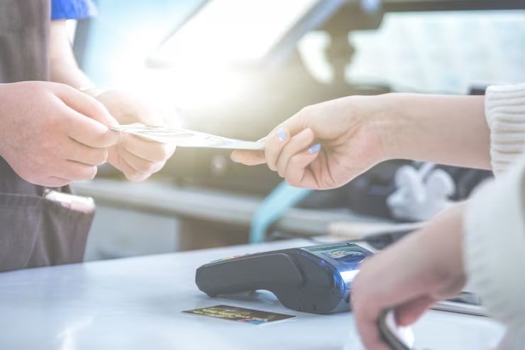 A Person Is Paying With A Credit Card In A Store - Security in the Top End, NT