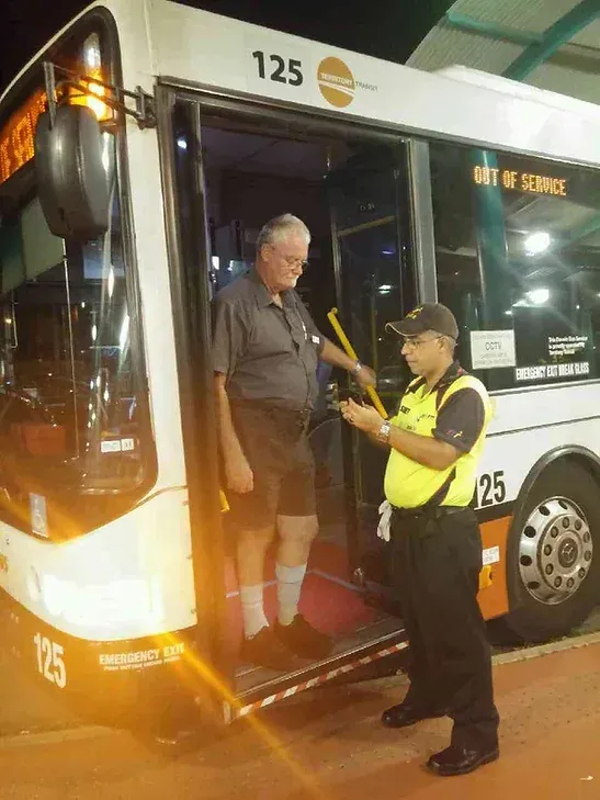A Security Guard Talking To A Bus Driver On A Bus - Professional Security in Darwin, NT
