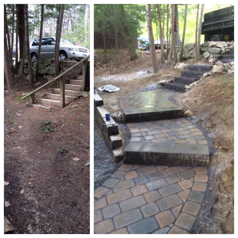 Outdoor stair and paver walkway on a wooded slope, showing an accessibility route beside parked cars.