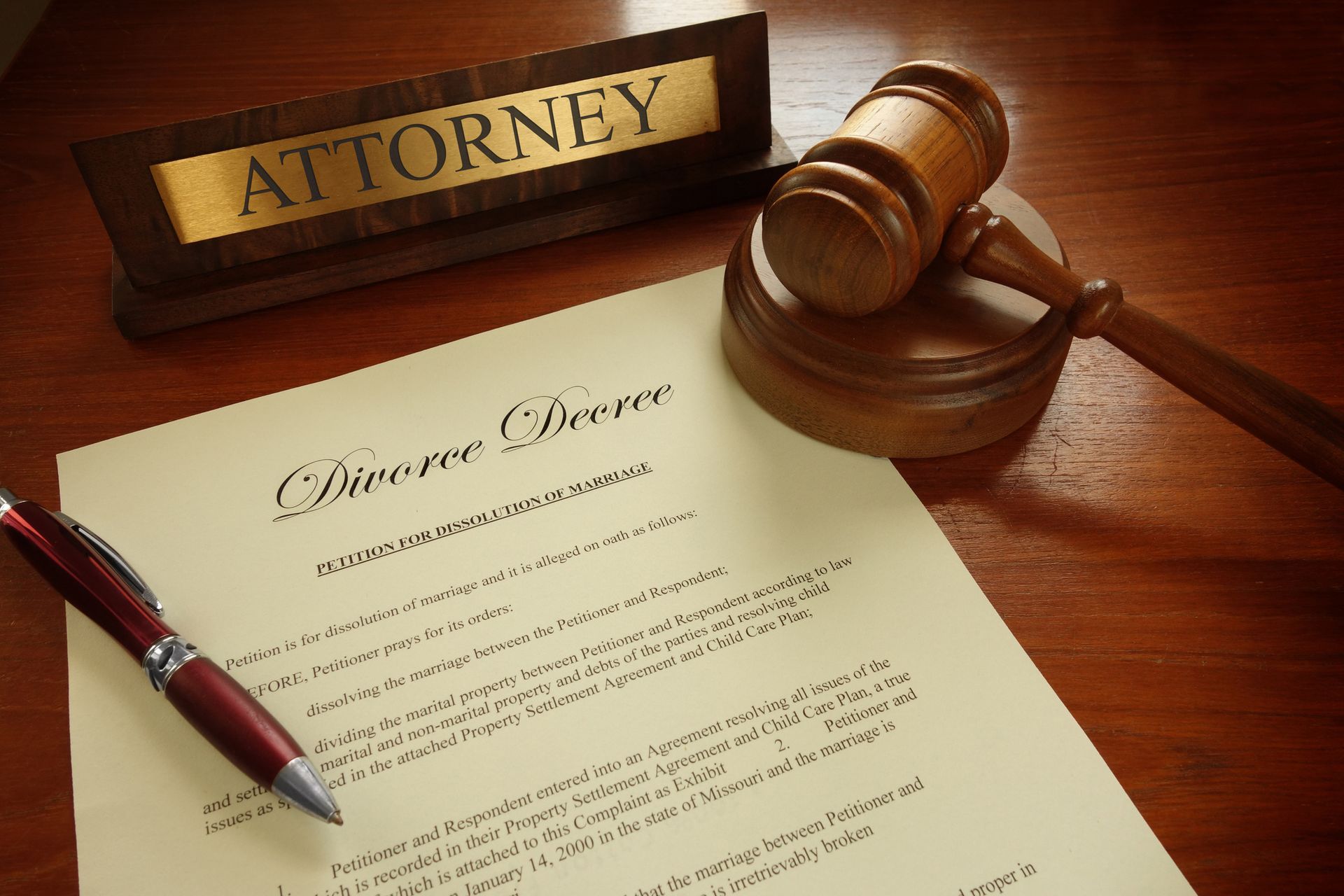 A divorce decree resting on an experienced divorce lawyer's desk awaiting review in Sunshine.