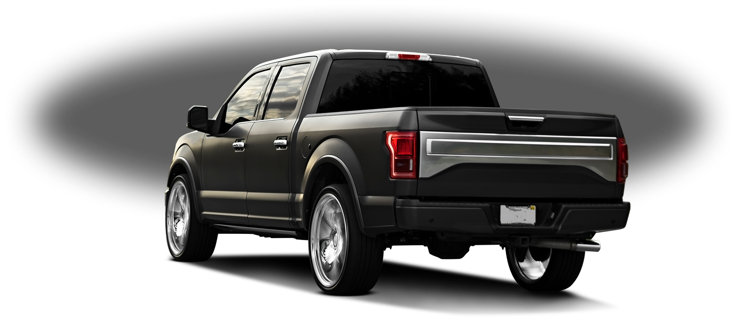 Black pickup truck shown from the rear on a white background
