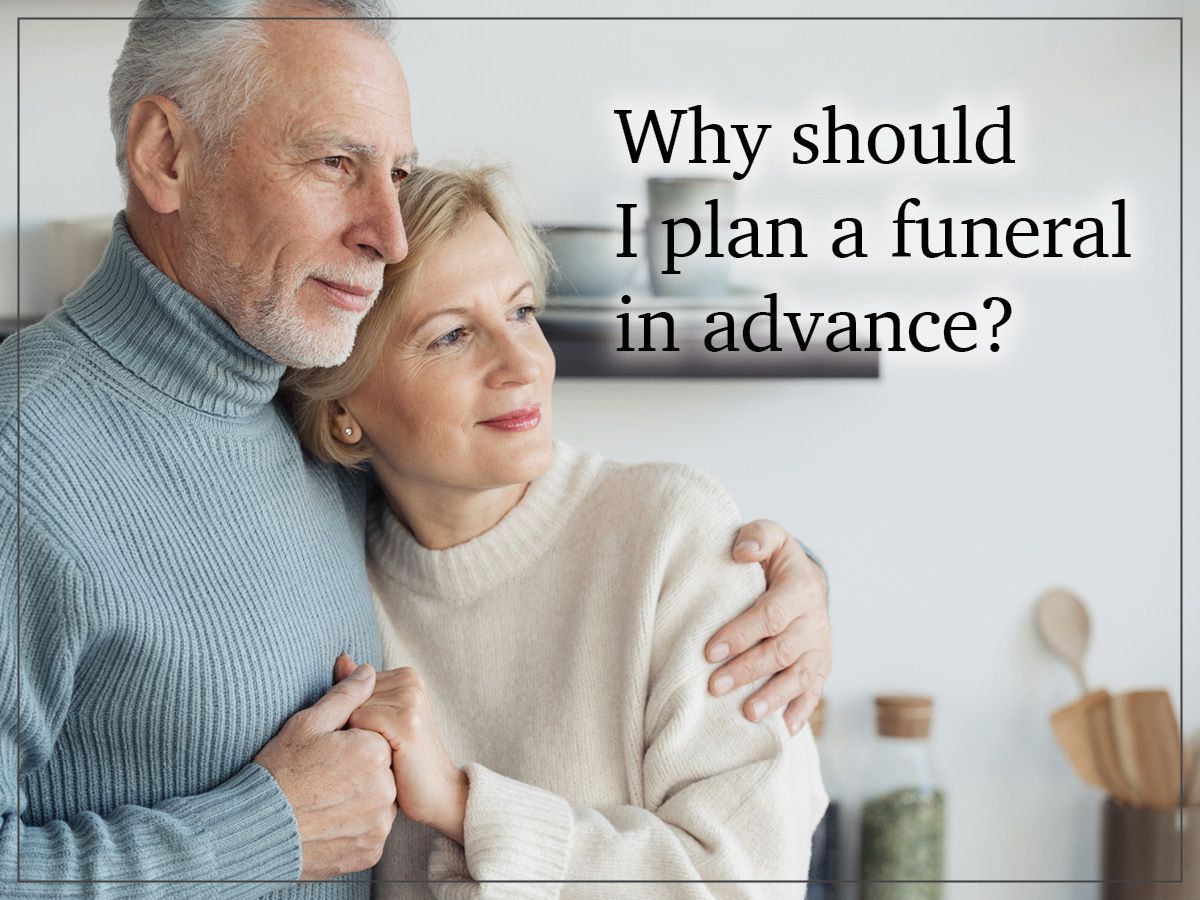 Elderly couple embracing beside text: “Why should I plan a funeral in advance?”