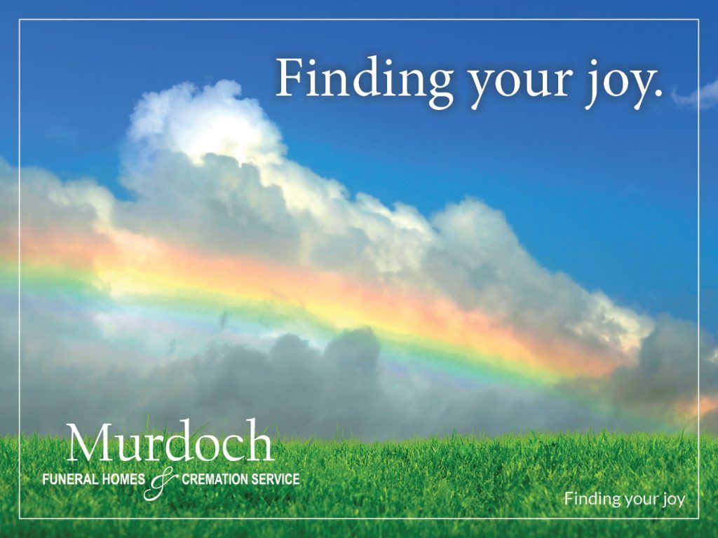 A picture of a rainbow in the sky with the words finding your joy