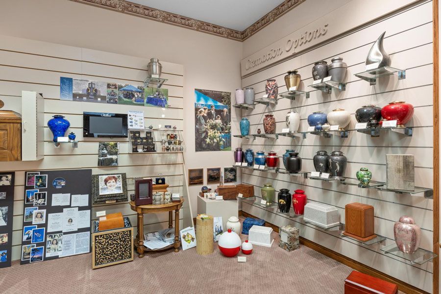 Shelves of colorful kitchenware and decor displayed in a small shop or showroom