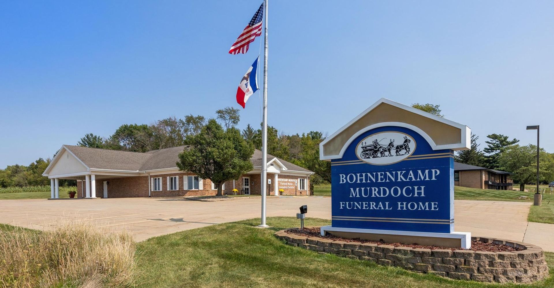 Bohnenkamp Mukwonago Middle School sign with flags in front of the building