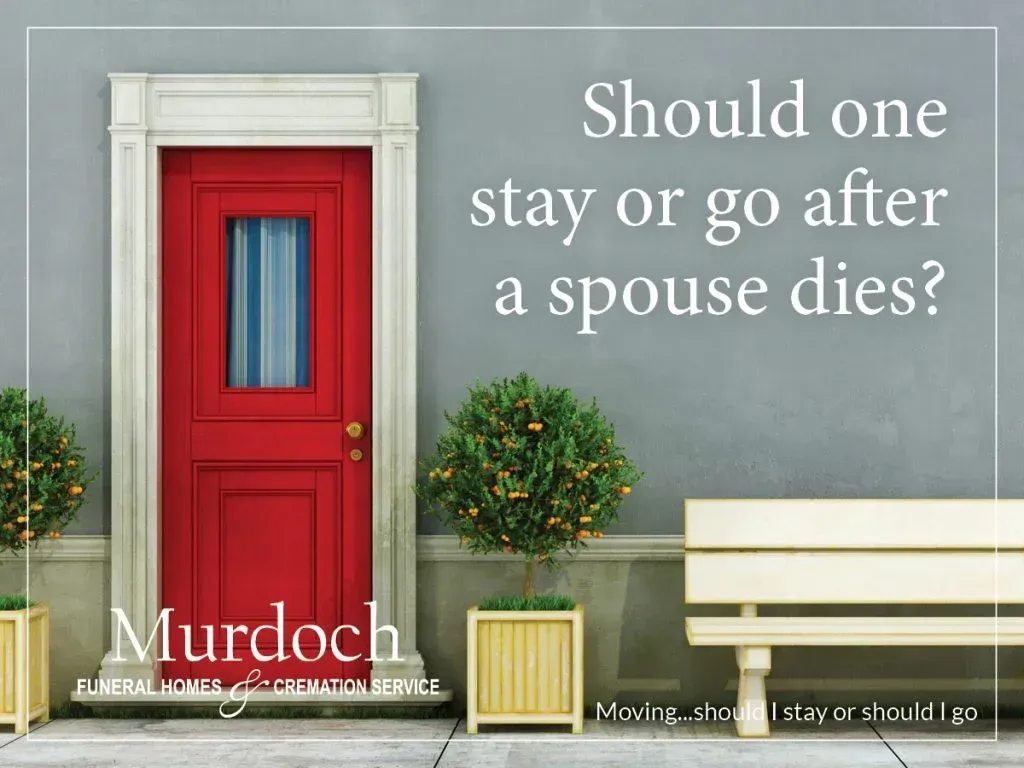 A red door with the words should one stay or go after a spouse dies