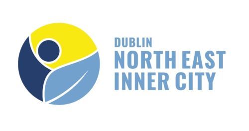 Dublin North East Inner City logo: yellow, blue circle with stylized person shape and leaf.