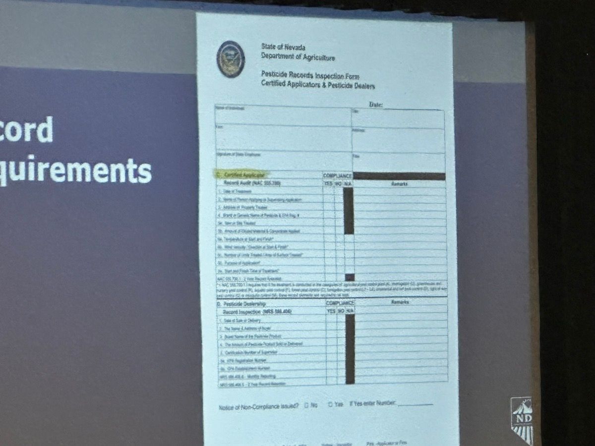 Projected document titled “Requirements” on a screen with a table of text.