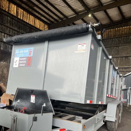 A dumpster with a sign on the side that says 