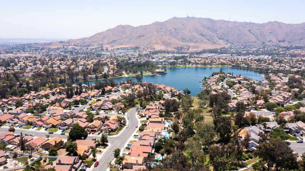 Daytime aerial view of a suburban neighborhood in Moreno Valley, California, USA.