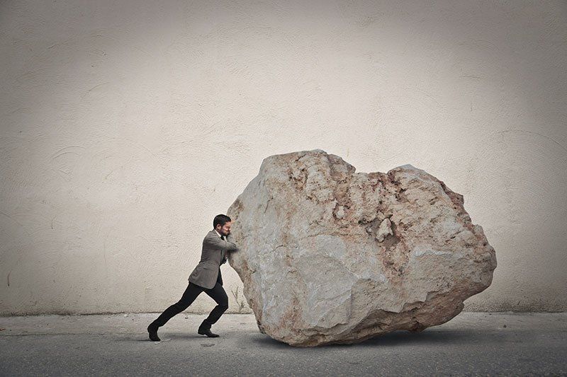 pushing a heavy rock