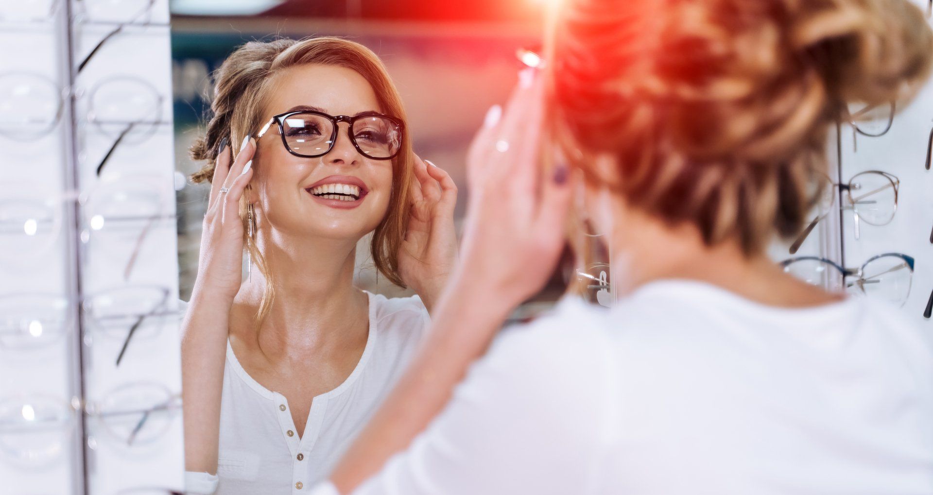 Woman trying on glasses