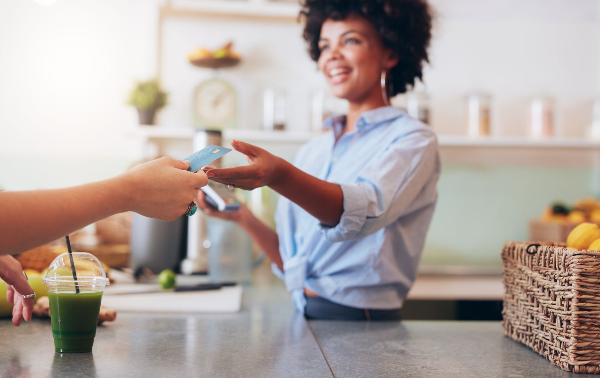 A small business owner conducts business happy that she has a San Diego Employee Benefits Broker on her side