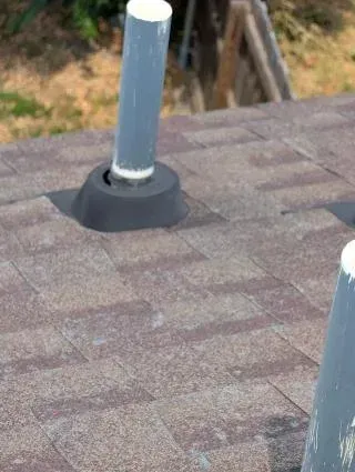 A close up of a roof with shingles on it.