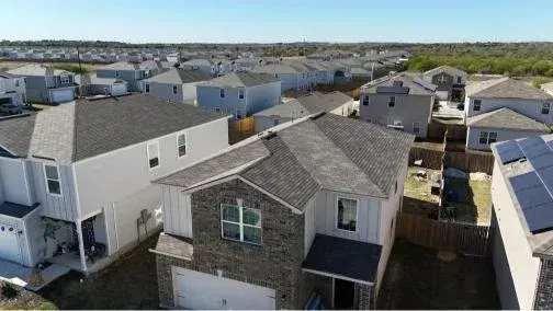 An aerial view of a roof with a lot of vents on it