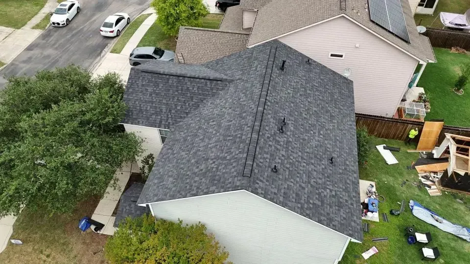 A large house with a brown roof and white trim
