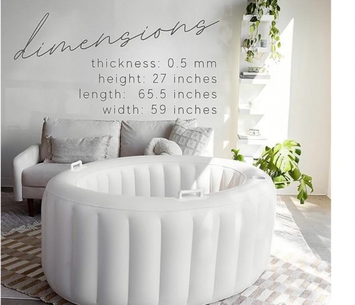 White inflatable baby crib in bright living room with dimensions text overlay