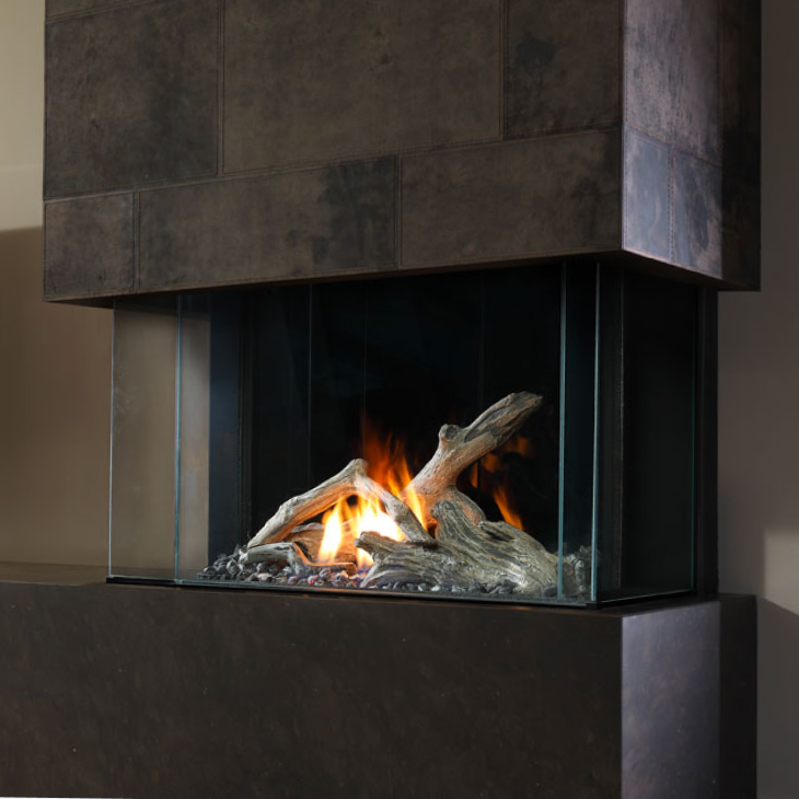 A fireplace with a lot of logs in it