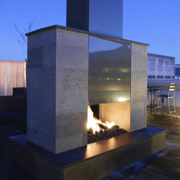 A fireplace with a fire coming out of it
